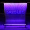Custom branded DELUX portable bar with ABSOLUT vodka logo in matching Pantone color, purple lights on.